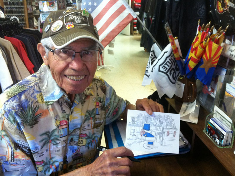 Angel signing one of his note cards