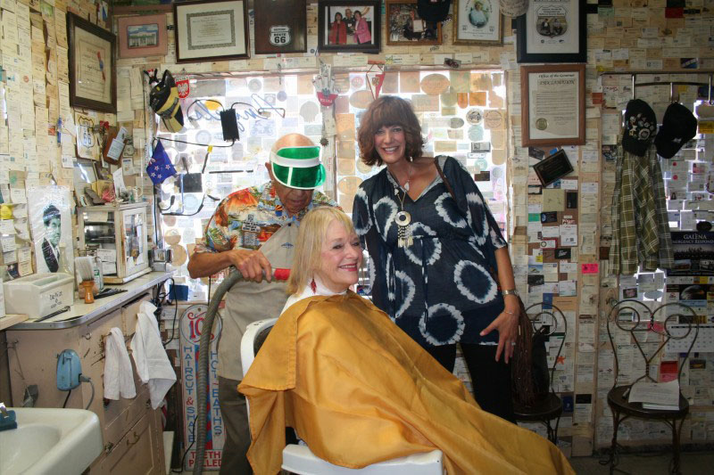Carol getting a hair cut from Angel