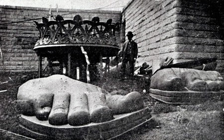 The feet of the Statue of Liberty arrive on Liberty Island in 1885 